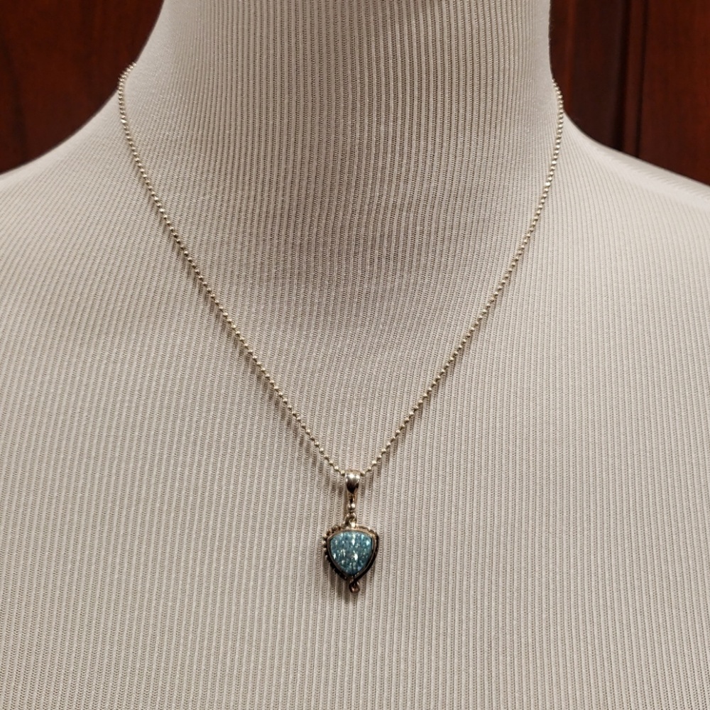 Necklace with light blue pendant